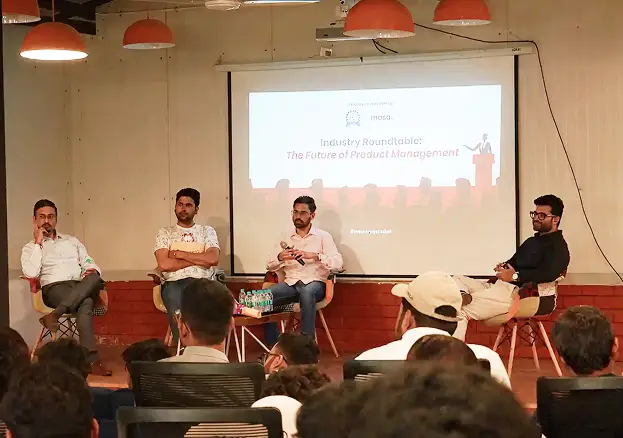 Panel discussion on stage at IIM Trichy campus