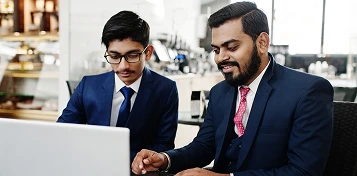 Trainee working alongside a senior manager