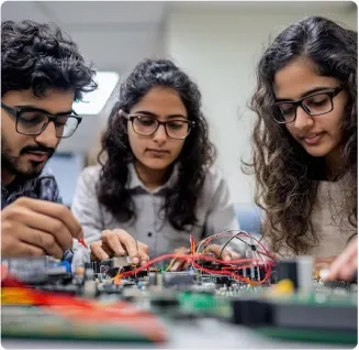 Students working on an embedded circuit board